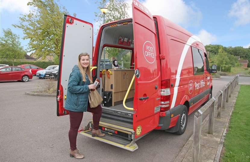 Ruth Betson, District Councillor for Bourn ward, stepping into the new mobile post office van – a hydraulic tailgate is available for wheelchair users and those with disabilities.