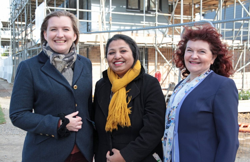 Ruth Betson, Shrobona Bhattacharya and Evelyne Spanner by the new affordable housing development in Back Lane, Cambourne.