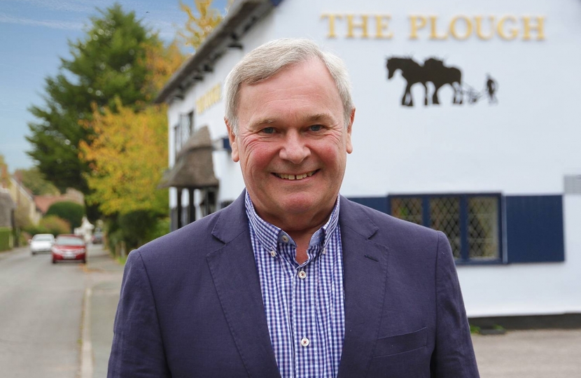 Stephen Edwards, the Conservative candidate for the Duxford ward in the South Cambridgeshire District Council elections on 3rd May 2018.  The new ward will be enlarged from two villages (Duxford and Ickleton) to five – Babraham, Duxford, Hinxton, Ickleton and Pampisford.  Stephen, here in Duxford, is a highly experienced local councillor.  He has been self-employed all his life, is a keen dog walker and a former cricketer.