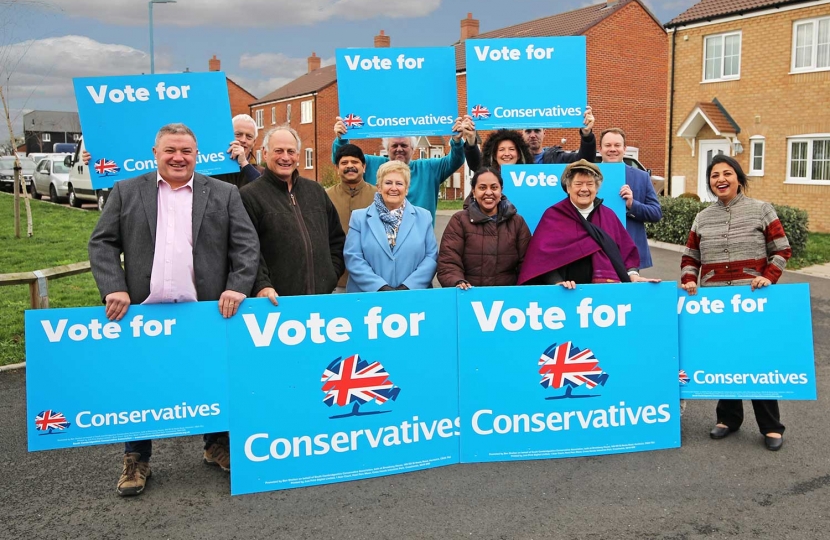 Conservative councillors and activists supporting more houses for local people in South Cambs – like the small development in Home Close, Swavesey where 20 council houses were built in 2016.  L to R back row: activists David Perkins, Sujit Bhattacharya and Colin Barker, Cambourne District Councillor Ruth Betson, activist Jason Butcher and Girton District Councillor Tom Bygott.  Front row: County and District Councillor Mark Howell, Caxton & Papworth District Councillor Nick Wright, Bar Hill District Council