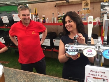 Heidi Allen MP pulling a pint at the Shelford Feast in July.